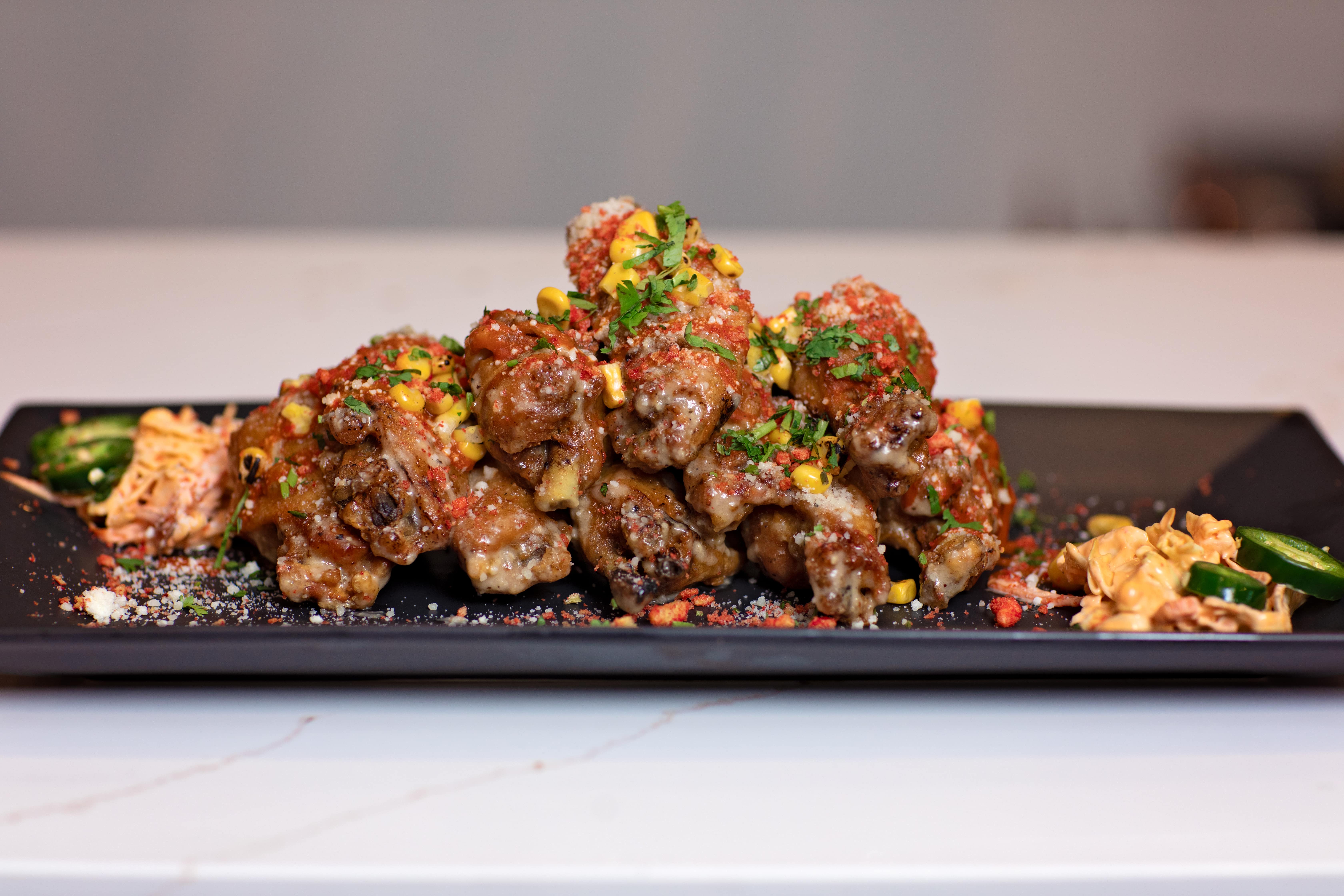 Glazed Korean fried chicken on a slate plate