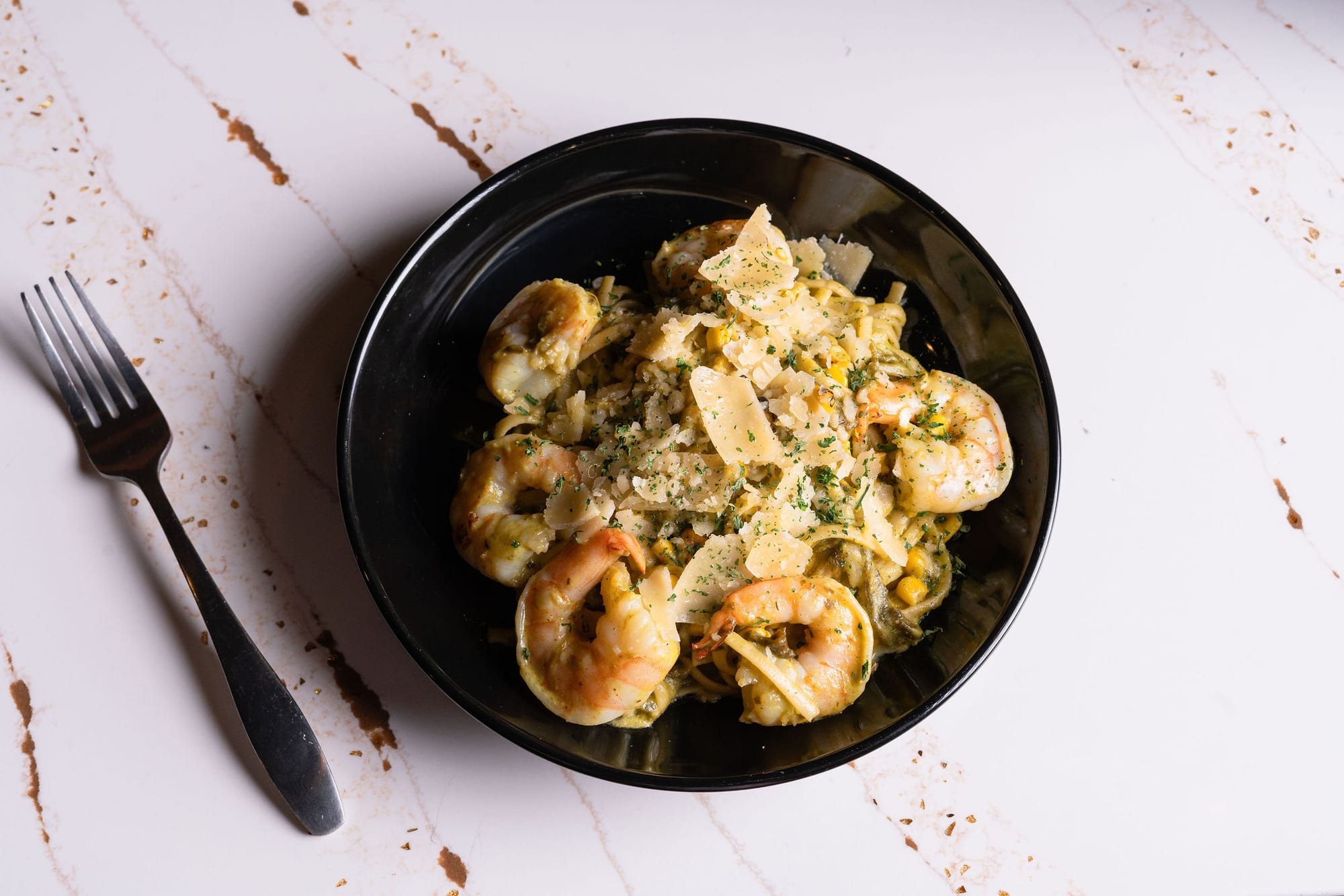 Shrimp pasta tossed in a herbed cream sauce
